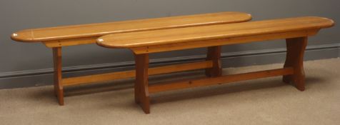 Pair pine benches on solid end supports joined by stretchers, W168cm, H47cm,