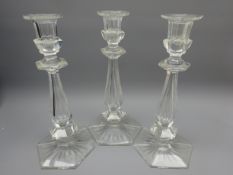 Set of three Edwardian cut glass candlesticks,