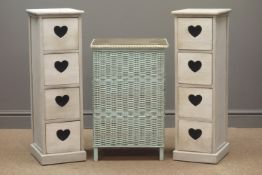 Two narrow four drawer chests with pierced heart handles (W25cm, H80cm, D28cm),