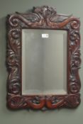 Victorian carved mahogany bevel edge mirror, W48cm,