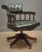 Leather swivel desk chair, upholstered in a dark green leather, deeply buttoned,