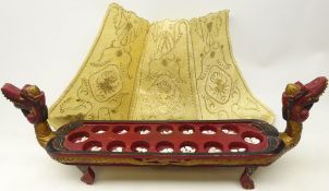 Carved Chinse stand in the form of a boat with dragon head terminals and gilt decoration,