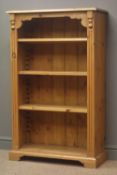 Pine open bookcase, projecting cornice, three adjustable shelves, reeded sides, shaped bracket feet,
