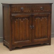 Mid 20th century oak sideboard, two drawers, above panelled cupboard doors, shaped apron,