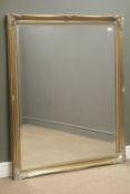 Rectangular bevel edge wall mirror in swept gilt frame, W105cm,