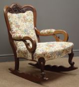 Victorian mahogany rocking chair, upholstered back, seat and arms, shaped and carved cresting rail,