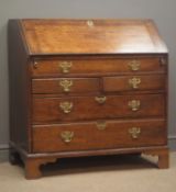 Georgian oak bureau, fall front enclosing fitted interior and well with sliding cover, one false,