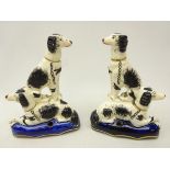 Pair Victorian Staffordshire pen holders each modelled with a pair of spaniels,