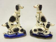 Pair Victorian Staffordshire pen holders each modelled with a pair of spaniels,