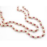 Long red and white freshwater pearl necklace,