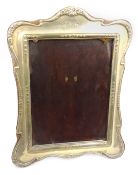 Silver freestanding photograph frame, raised garland decoration, Chester 1915, mahogany back,