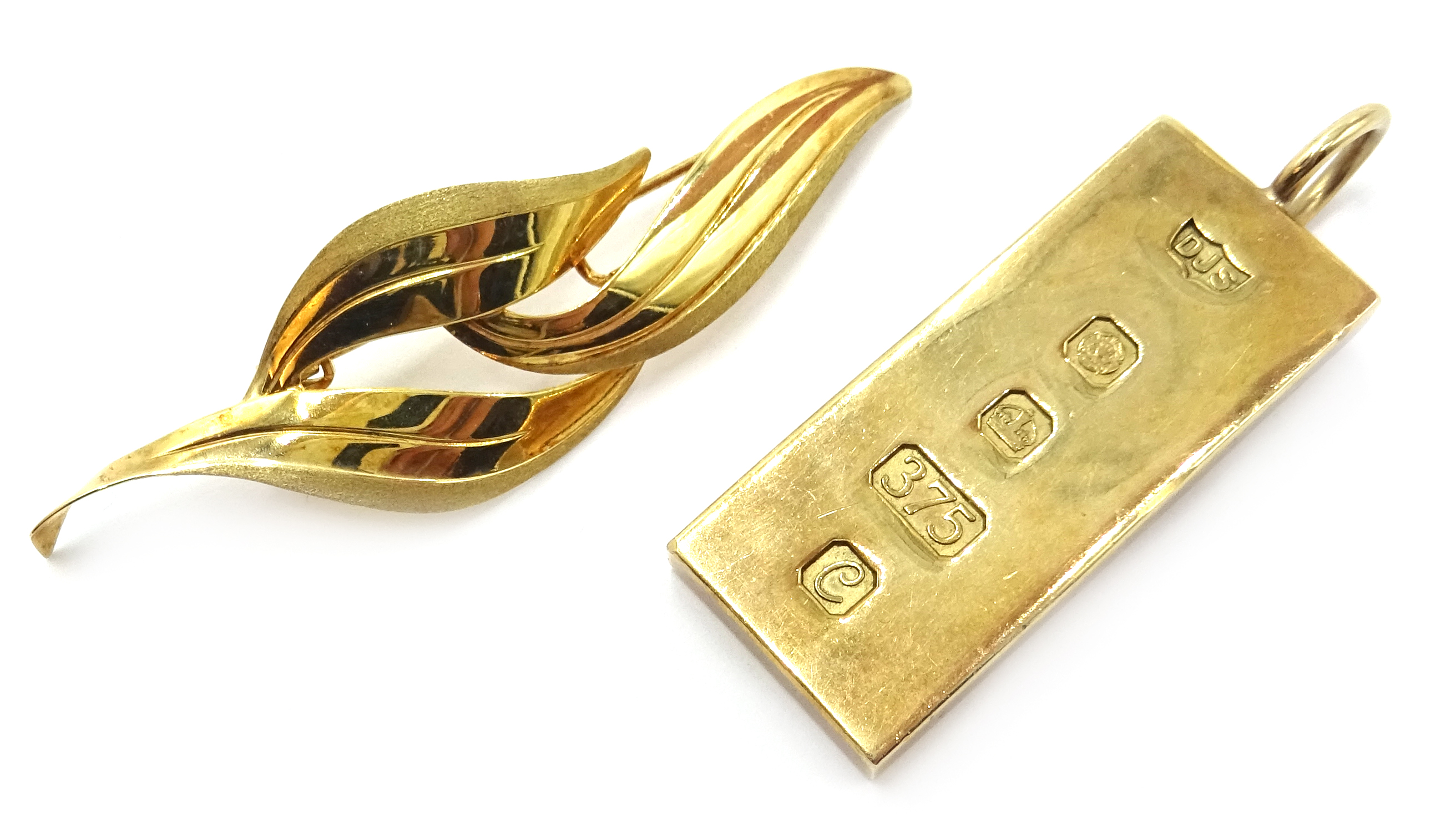 9ct gold ingot pendant hallmarked 30gm and a 9ct gold leaf brooch hallmarked 2gm