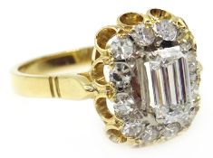 18ct gold emerald cut diamond, with diamond surround, central diamond approx 0.