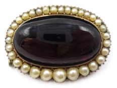 Early Victorian gold cabochon garnet and graduating split pearl set mourning brooch,