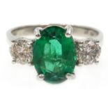 18ct white gold oval emerald and round brilliant cut diamond ring, hallmarked, emerald approx 1.