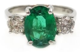 18ct white gold oval emerald and round brilliant cut diamond ring, hallmarked, emerald approx 1.