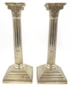 Pair of silver corinthian column candlesticks by Hawksworth, Eyre & Co Ltd Sheffield 1902,