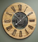 Large circular planked pine wall clock with Roman numerals,