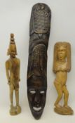 Two Tribal art carved figures and a carved tribal elongated mask,