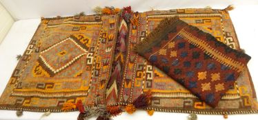 Kilim rug with geometric decoration on maroon ground,