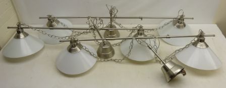 Three extendable hanging double light fittings,