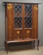 Art Nouveau inlaid display cabinet, projecting cornice, lead glazed doors, shaped apron,