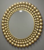 Gilt framed circular wall mirror, frame decorated with graduating balls,