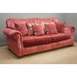 Grand sofa upholstered in a maroon velvet fabric,