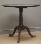 19th century mahogany tilt top tripod table, circular carved top with wells, single turned column,