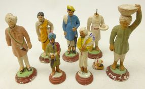 Group of seven early 20th century Indian painted clay & plaster figures,