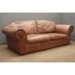 Two seat sofa upholstered in brown leather,