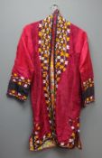 Turkoman/ Afghan robe, silk with embroidered trailing leafage and chintz pattern lining,