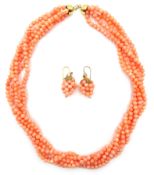 Five strand coral bead necklace on gold clasp stamped 750 and a similar pair of pendant coral