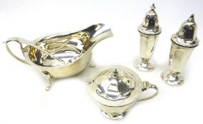Silver sauce boat with matching ladle and a three piece cruet set both by Viner's Ltd Sheffield