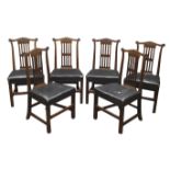 Set of six George III country walnut dining chairs,