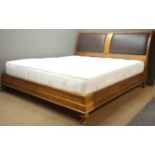 Quality reproduction walnut 6' SuperKing bedstead with padded leather headboard on turned feet,