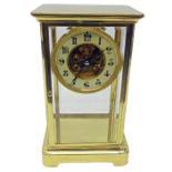 Victorian brass four glass mantel clock, with bevelled plates,