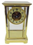 Victorian brass four glass mantel clock, with bevelled plates,