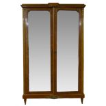 19th century French Empire style walnut wardrobe with kingwood banding and gilt metal mounts,