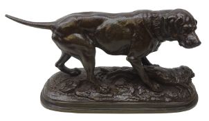 Patinated bronze model of a Gun Dog with a rabbit in the style of P J Mene,