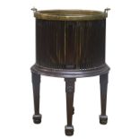 George lll style mahogany Oyster Pail, cylindrical stick body with brass liner and swing handle,