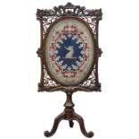 Victorian rosewood fire screen, frame carved with scrolls, shells and foliage,