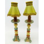 Pair of polychrome painted Table Lamps, on scroll carved bases, with shades,
