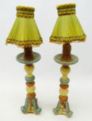 Pair of polychrome painted Table Lamps, on scroll carved bases, with shades,