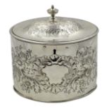 George III silver oval tea caddy, embossed flower decoration by I.B London 1786, H14.