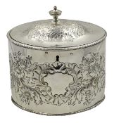 George III silver oval tea caddy, embossed flower decoration by I.B London 1786, H14.