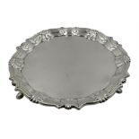 George II silver waiter, shell and scroll border, on three hoof feet by William Peaston,