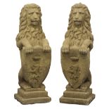 Pair stone effect seated lions, holding crested shield, stepped plinth base,