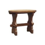 'Gnomeman' oval adzed rectangular oak table, shaped end supports with pegged centre stretcher,