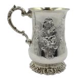 Victorian silver christening mug with embossed flower decoration and gilt interior by John Evans II,
